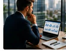Professional working at a desk with laptop by a window